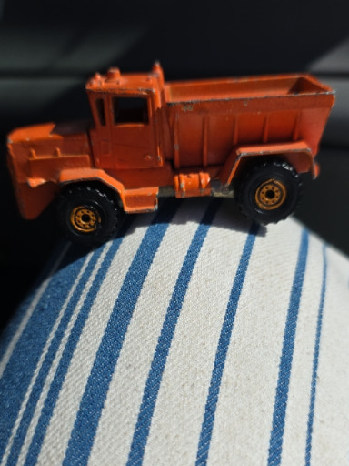 Die-cast toy truck 'Oshkosh Snow Plow' by Hot Wheels
