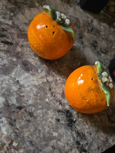 Ceramic orange-shaped salt and pepper shakers by Holt Howard