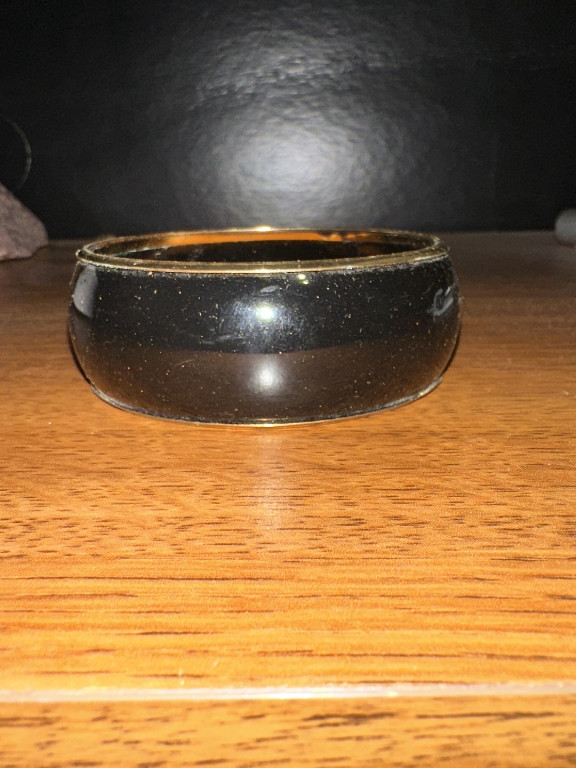 Black enamel hinged bangle bracelet with gold-tone trim