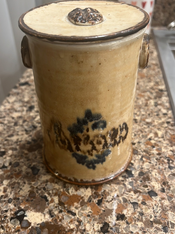 Stoneware crock with cobalt blue decoration and lion head handles, signed by maker
