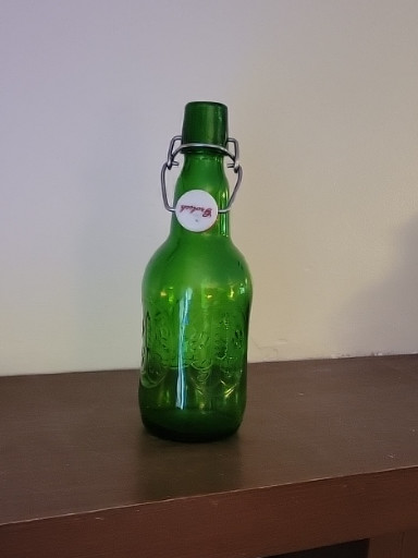 Green glass swing-top beer bottle by Grolsch
