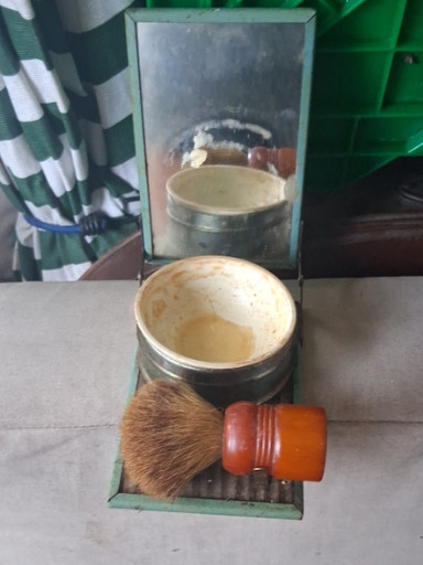 Vintage folding travel shaving set with mirror, soap cup, and brush