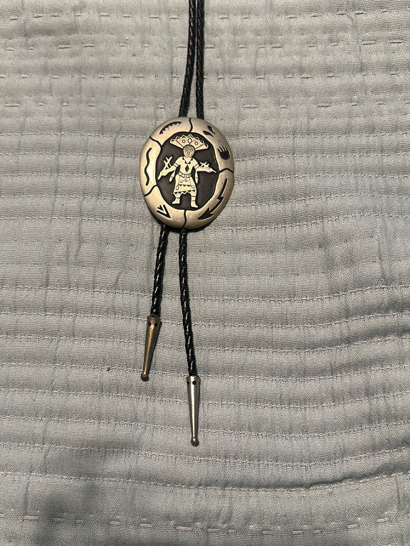 Sterling silver bolo tie featuring Hopi Kachina figure overlay design