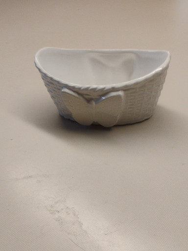 White ceramic basket-weave bowl with bow detail