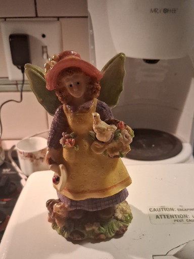 Resin figurine titled 'Gardening Angel Girl with Watering Can'
