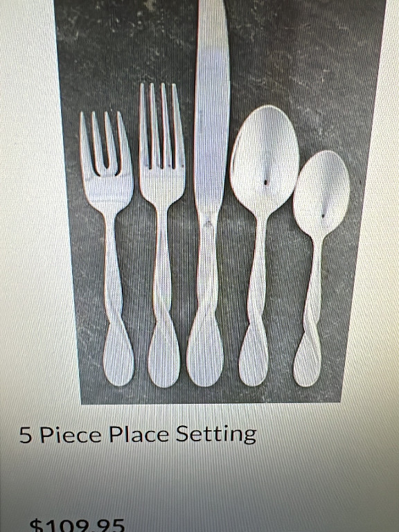 Stainless steel flatware set titled 'Satin Aquarius' by Oneida Silver