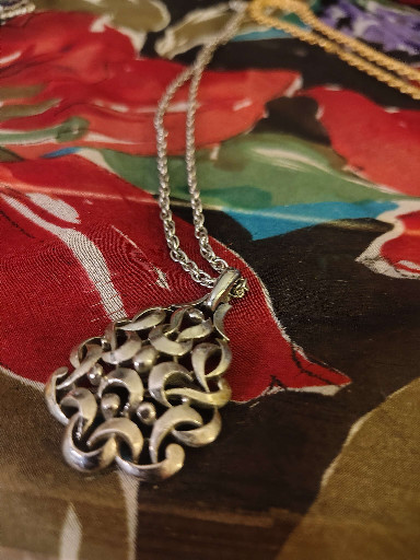 Gold-tone metal openwork pendant necklace by Crown Trifari