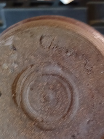 Stoneware pottery vessel with brown glaze, artist-signed