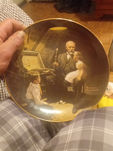 Porcelain collector plate titled 'Grandpa's Treasure Chest' by Norman Rockwell, produced by Knowles