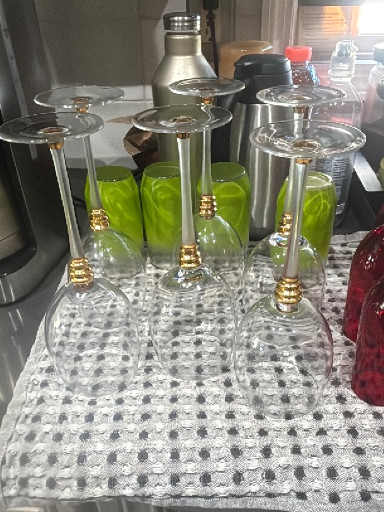 Set of wine glasses with frosted stems and gold ring accents
