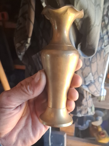 Brass decorative vase with flared rim and pedestal base