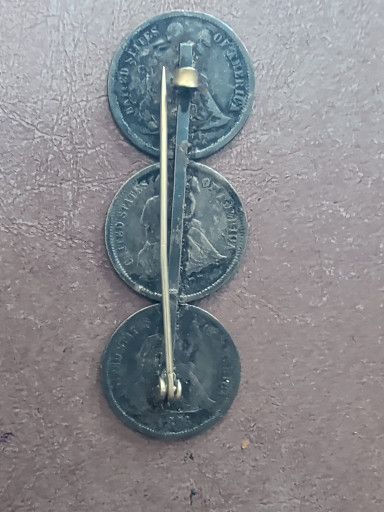 Silver coin brooch made from three British threepence coins