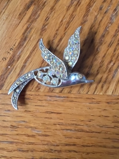 Silver-tone brooch titled 'Bird of Paradise' by Sarah Coventry