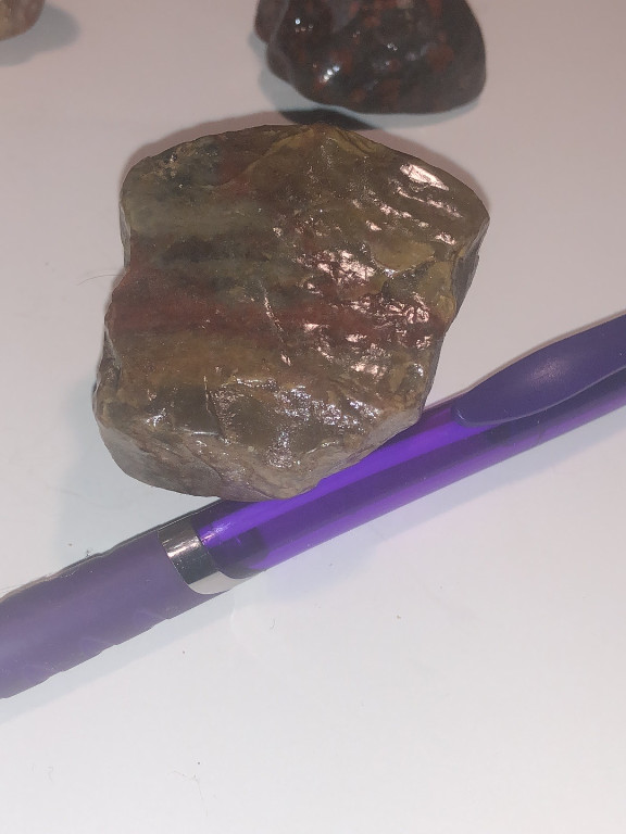 Natural rough opal specimen, possibly opalized wood or boulder opal, weighing 110 grams