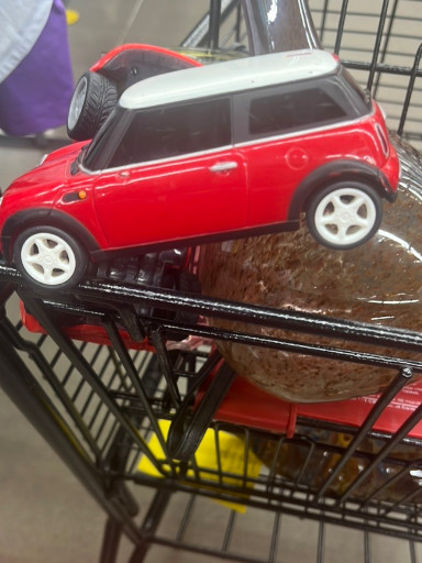 Radio-controlled 1:24 scale model car of a red Mini Cooper by Nikko