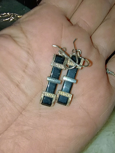 Pair of vintage earrings featuring black enamel and rhinestone accents in silver-tone metal, attributed to Kenneth Jay Lane