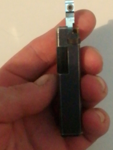 Vintage pocket lighter with black enamel finish