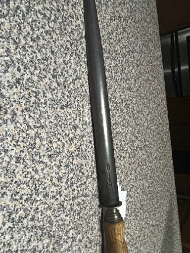 Antique Japanese katana (samurai sword) with wooden handle and steel blade