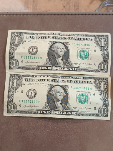 Two consecutive serial number $1 Federal Reserve Notes from 2021, Series 2021, Atlanta Federal Reserve District