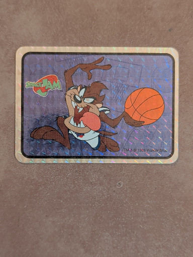 Vintage 1996 'Space Jam' prism sticker featuring Tasmanian Devil with basketball