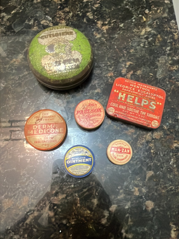 Collection of vintage medicine and pharmaceutical tins