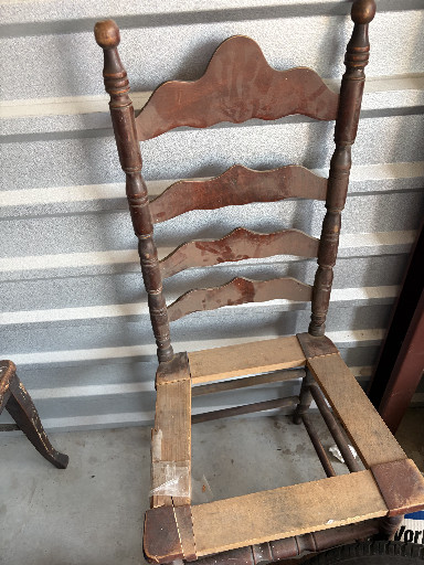 Antique ladder-back side chair with turned posts and shaped slats
