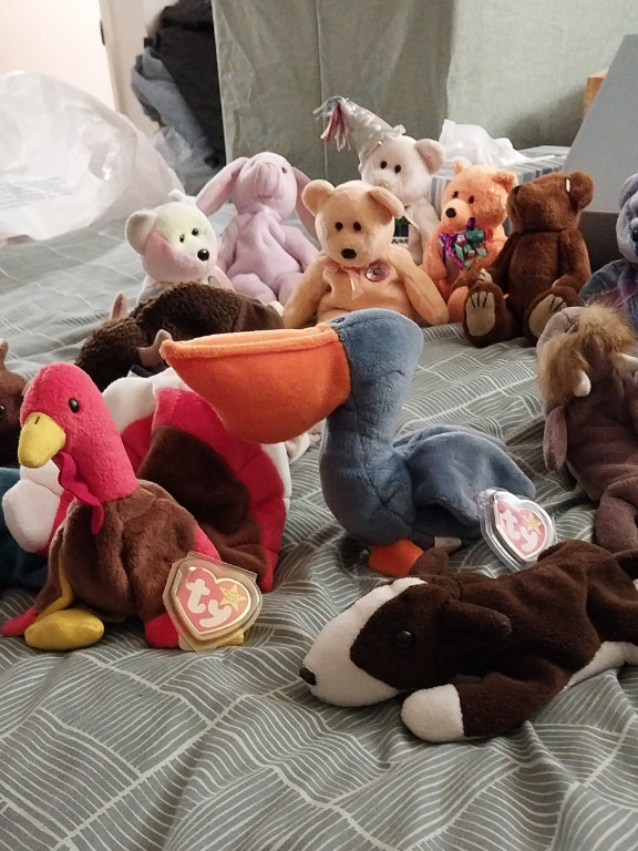 Collection of Ty Beanie Babies plush toys including Scoop the Pelican