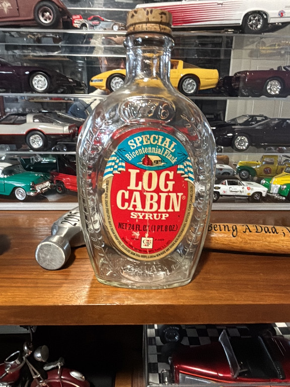 Glass bottle of Log Cabin Syrup, Bicentennial commemorative edition from 1976