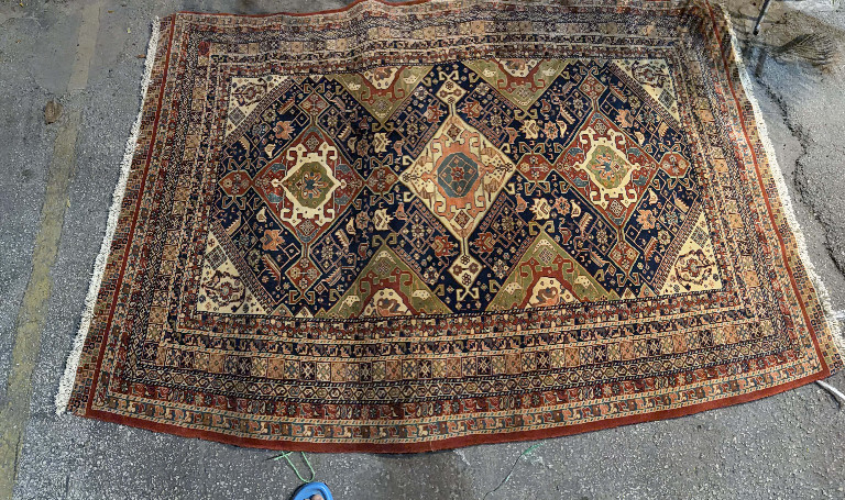 Handwoven wool Persian Qashqai tribal rug with geometric diamond pattern