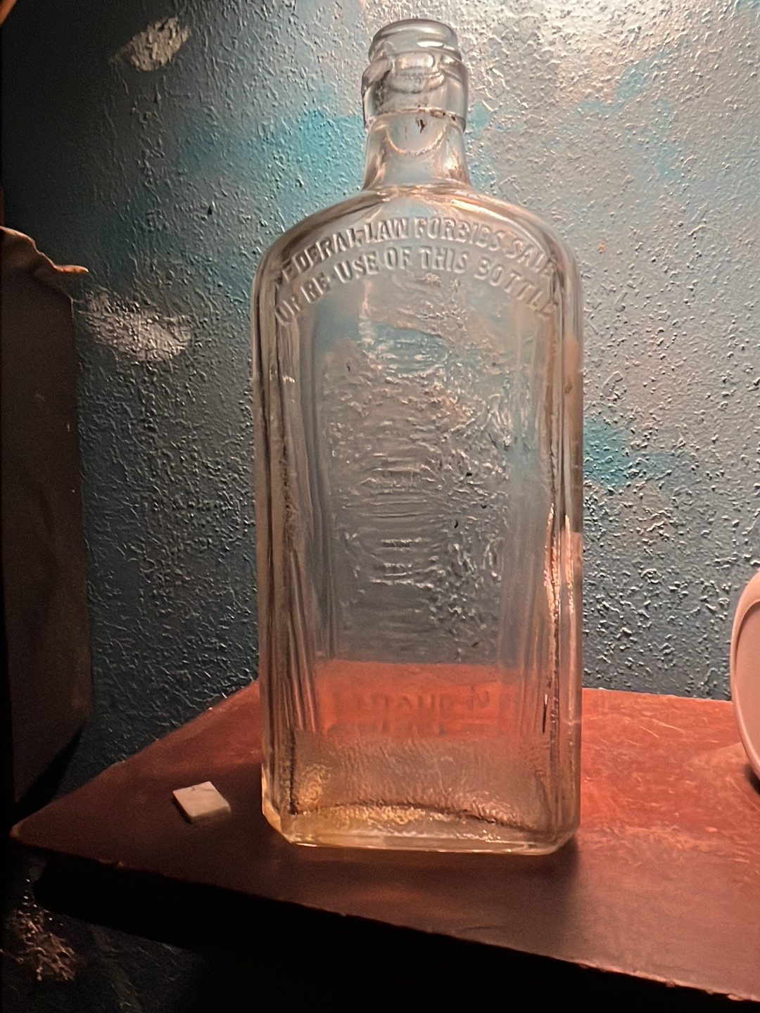 Glass bottle from Federal Law Forbids Sale or Re-Use of This Bottle era