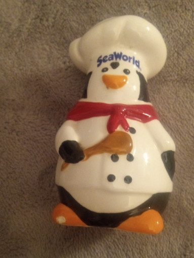 Ceramic spoon rest titled 'SeaWorld Chef Penguin' by Ronnie's Ceramic Co., designed by Doug Wylie