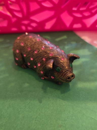 Bronze pig figurine with pink rhinestone embellishments