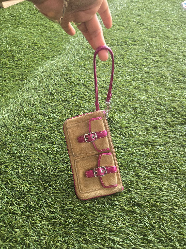 Suede and leather wristlet by Coach