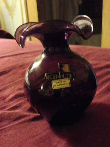 Amethyst glass vase with applied clear handle, labeled 'Regenhutte Made in Germany'