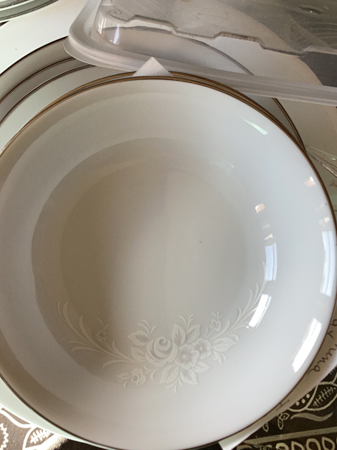 Fine porcelain soup bowl with embossed floral design and gold trim by Johann Haviland