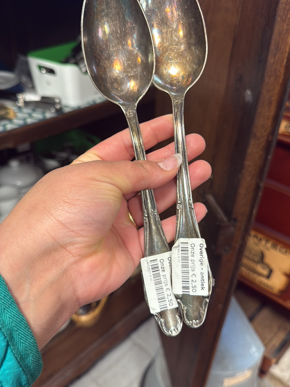 Pair of stainless steel oval soup spoons in Victorian Charm pattern by International Silver (Insico)
