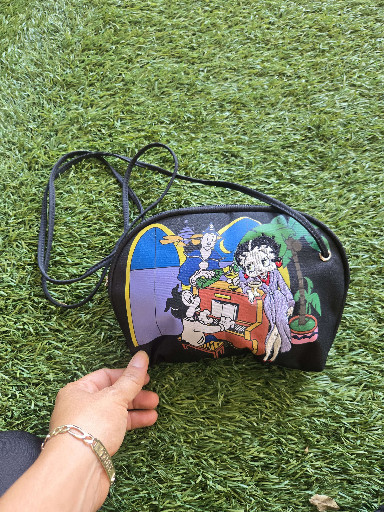 This item is a vintage Betty Boop embroidered nylon crossbody bag