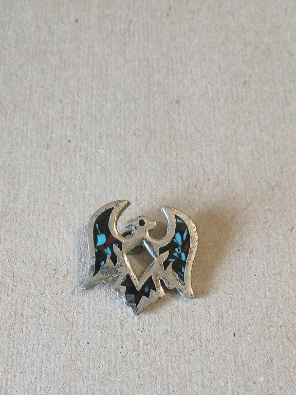 Sterling silver pendant with turquoise chip inlay in Thunderbird design