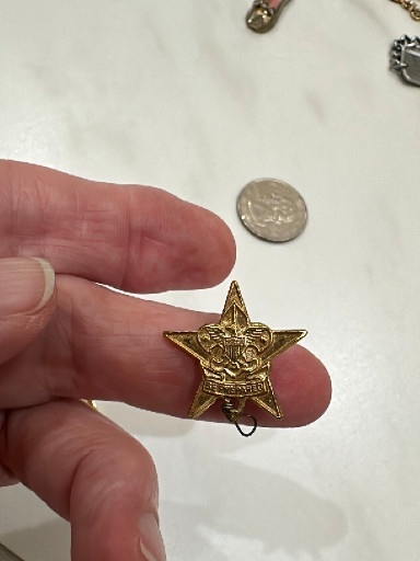 Gold-tone Boy Scouts of America Star Rank pin with hanging knot, circa 1940s