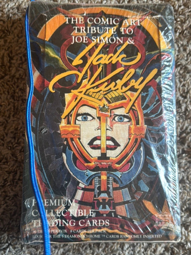 Sealed pack of 'The Comic Art Tribute to Joe Simon & Jack Kirby' premium collectible trading cards