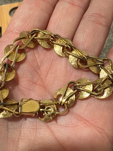 Gold-tone metal bracelet with textured disc link design