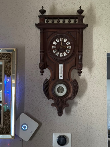 Walnut wall clock with barometer and thermometer