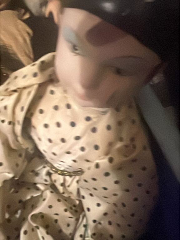 Porcelain figurine of a woman in a polka-dot dress