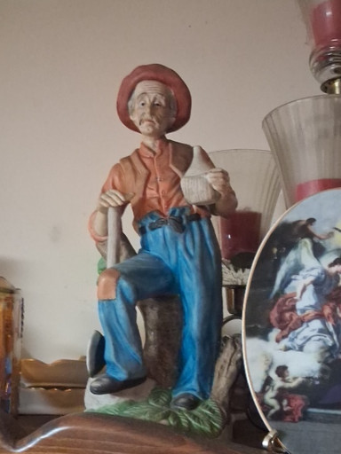 Ceramic figurine titled 'Old Man with Axe on Tree Stump' by UCGC Taiwan