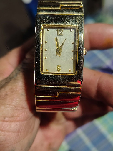 Gold-tone rectangular bangle watch