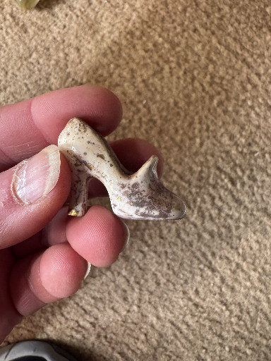 Porcelain miniature high-heel shoe figurine with gold trim