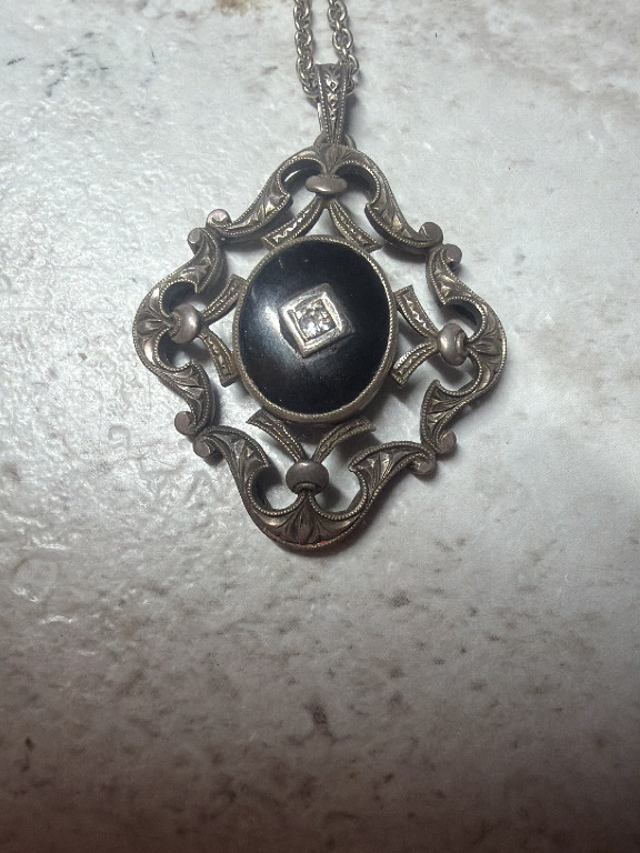 Sterling silver pendant with black onyx and diamond accent