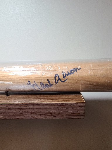Autographed wooden baseball bat signed 'Hank Aaron'