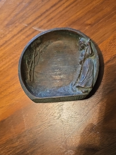 Bronze relief dish depicting a female figure beside a tree