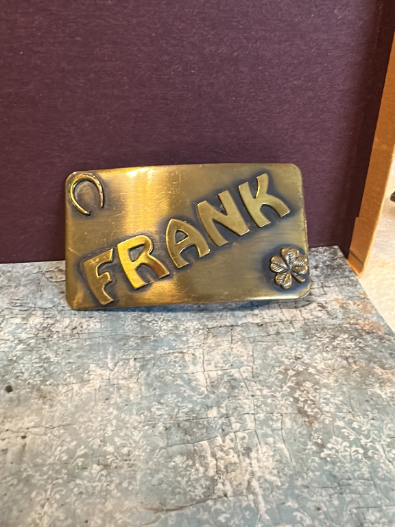 Brass belt buckle with personalized name 'FRANK' and horseshoe decoration